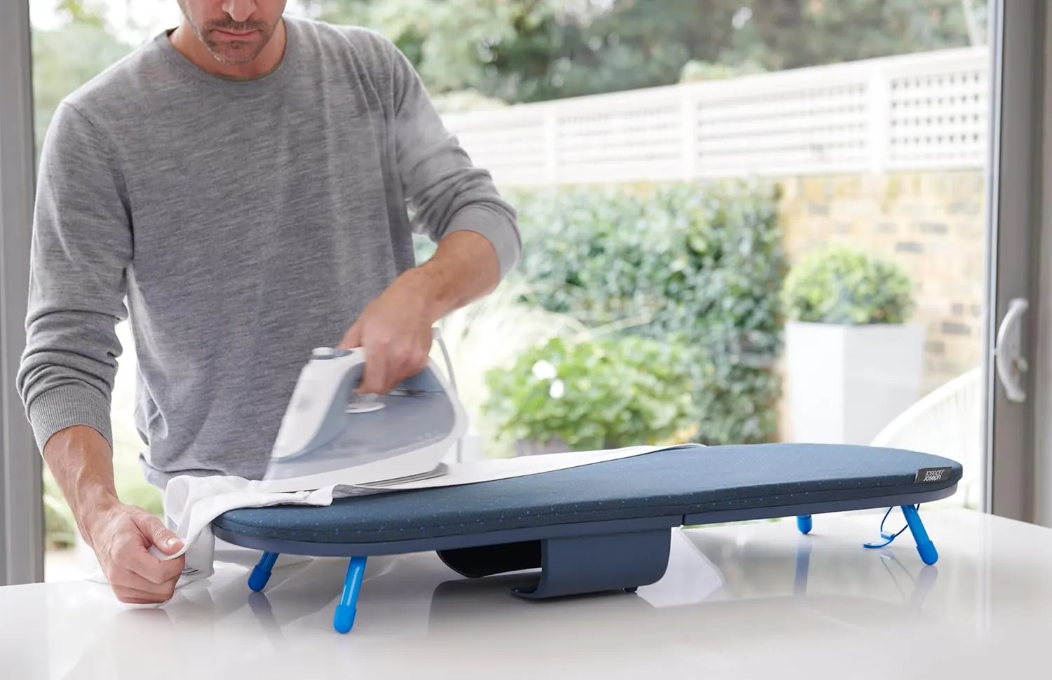 Joseph Joseph Pocket Plus Folding Space saving Compact Tabletop Ironing Board with Iron Holder and wall mount, Blue/Black